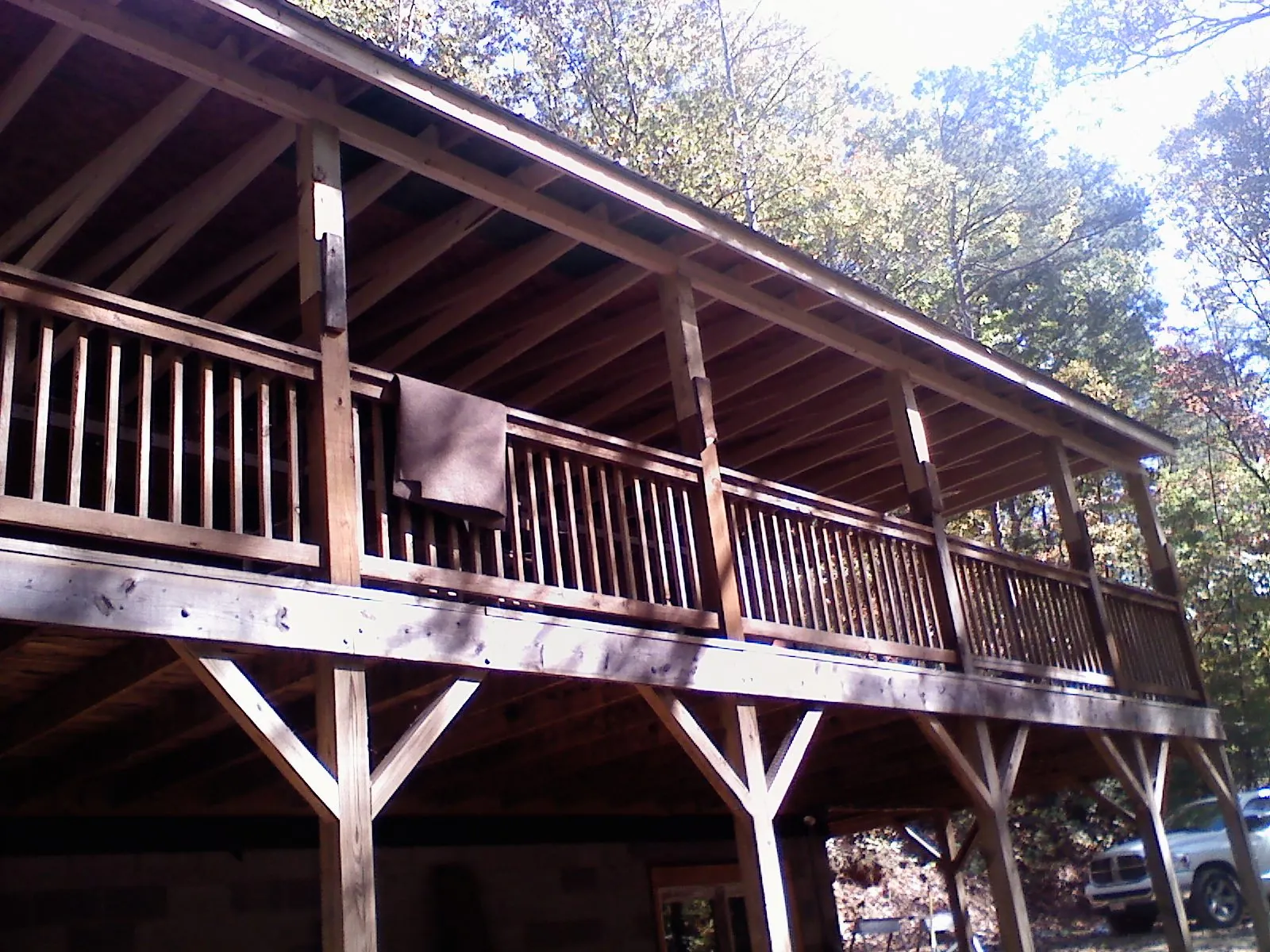 Timber framing under a new elevated porch and deck — Roof Leak Repair in Maple Lake by Roofing Brothers
